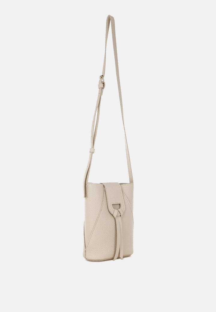 flap closure sling bag by rag#color_off-white