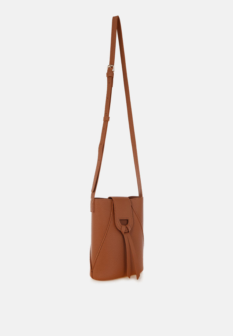 flap closure sling bag by rag#color_tan