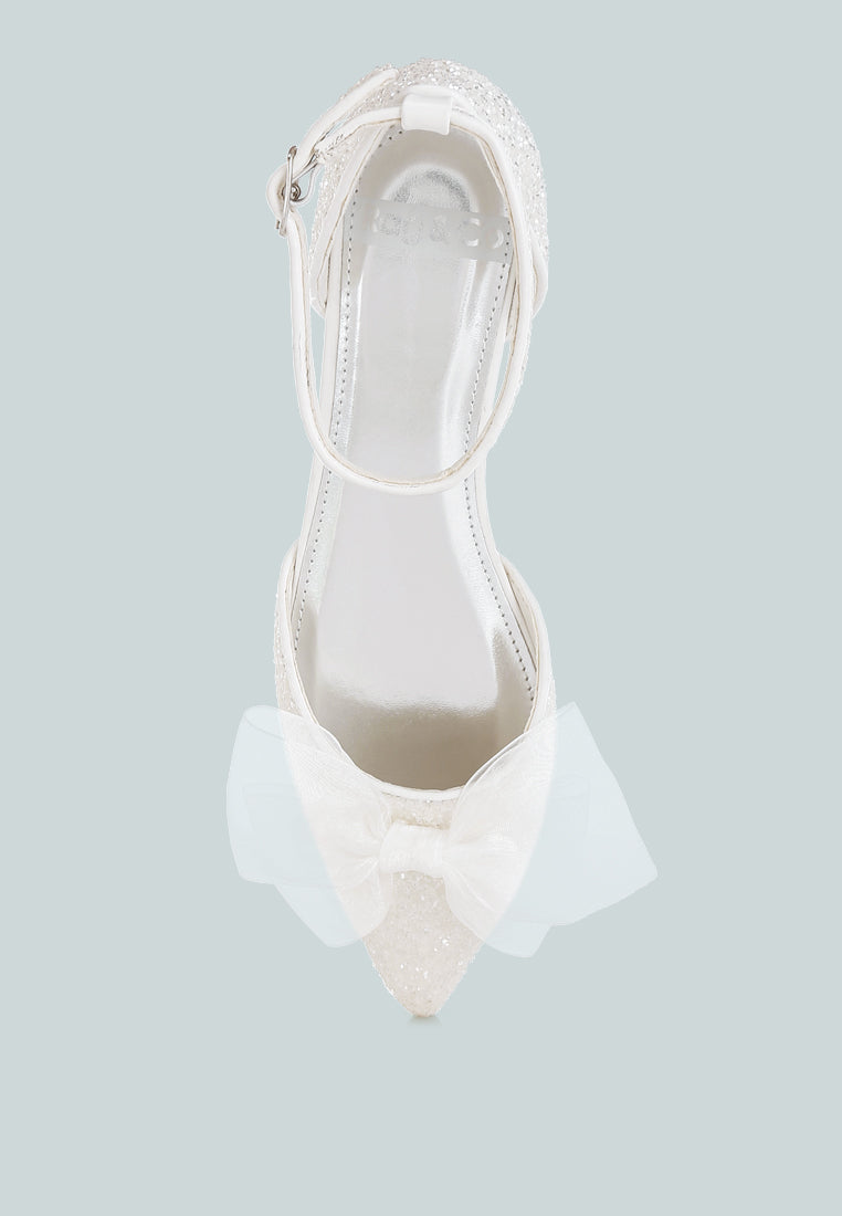 Sandalias planas con purpurina y detalle de lazo transparente Clarice#color_white