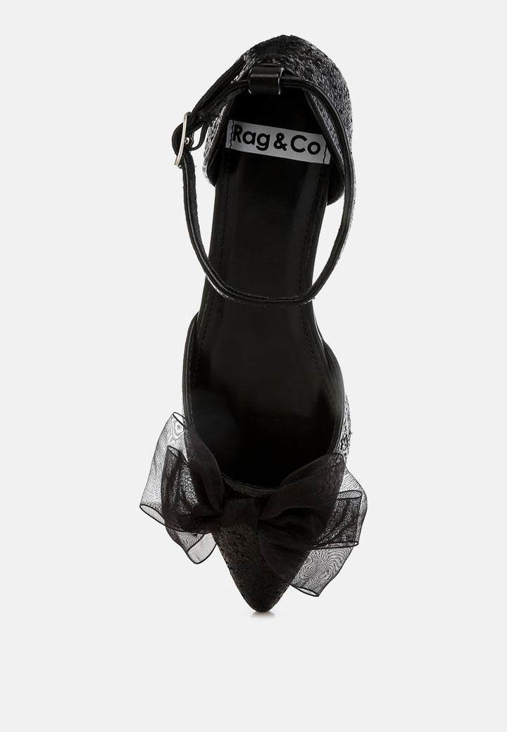 Sandalias planas con purpurina y detalle de lazo transparente Clarice#color_black