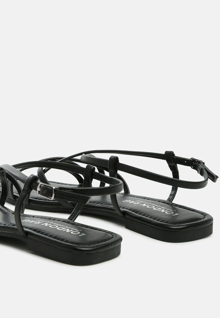 molly cuddles cross strap detail flat sandals#color_black