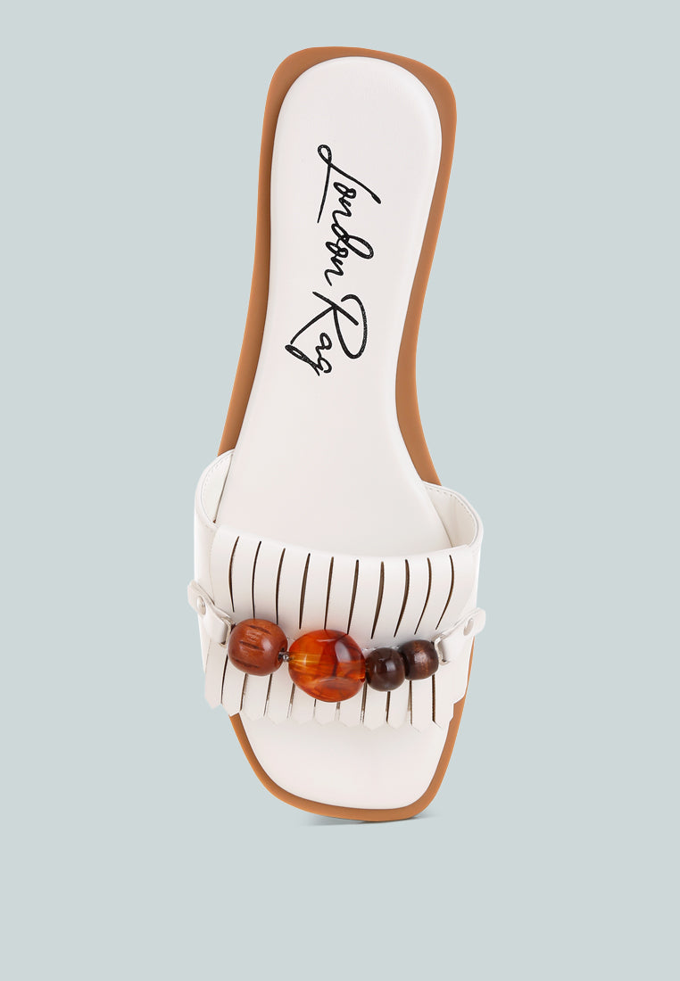 nakasa beaded faux leather slip ons by motes#color_white-faux-leather