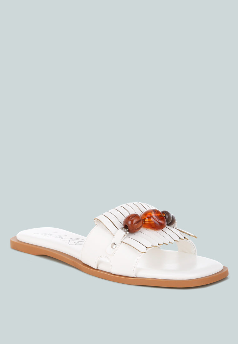 nakasa beaded faux leather slip ons by motes#color_white-faux-leather