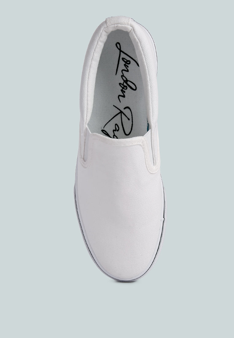 riddler white slip on canvas sneakers by rag#color_white