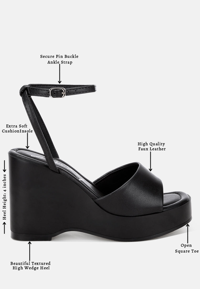 sangria solid platform faux leather wedges by motes#color_black