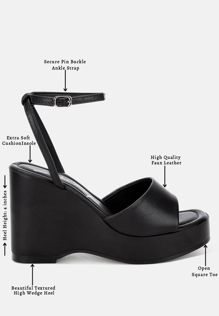 sangria solid platform faux leather wedges by motes#color_black