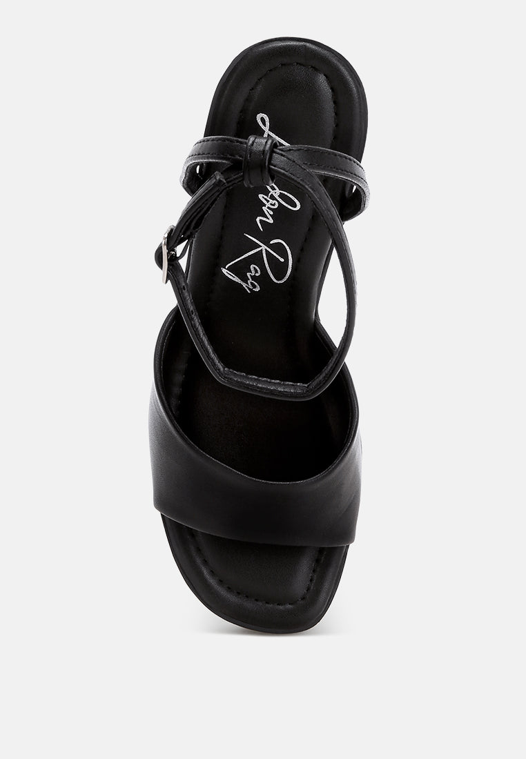 sangria solid platform faux leather wedges by motes#color_black