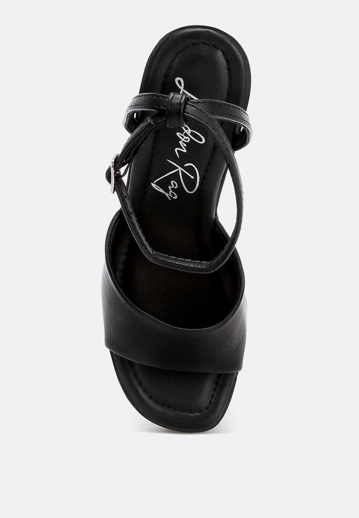 sangria solid platform faux leather wedges by motes#color_black