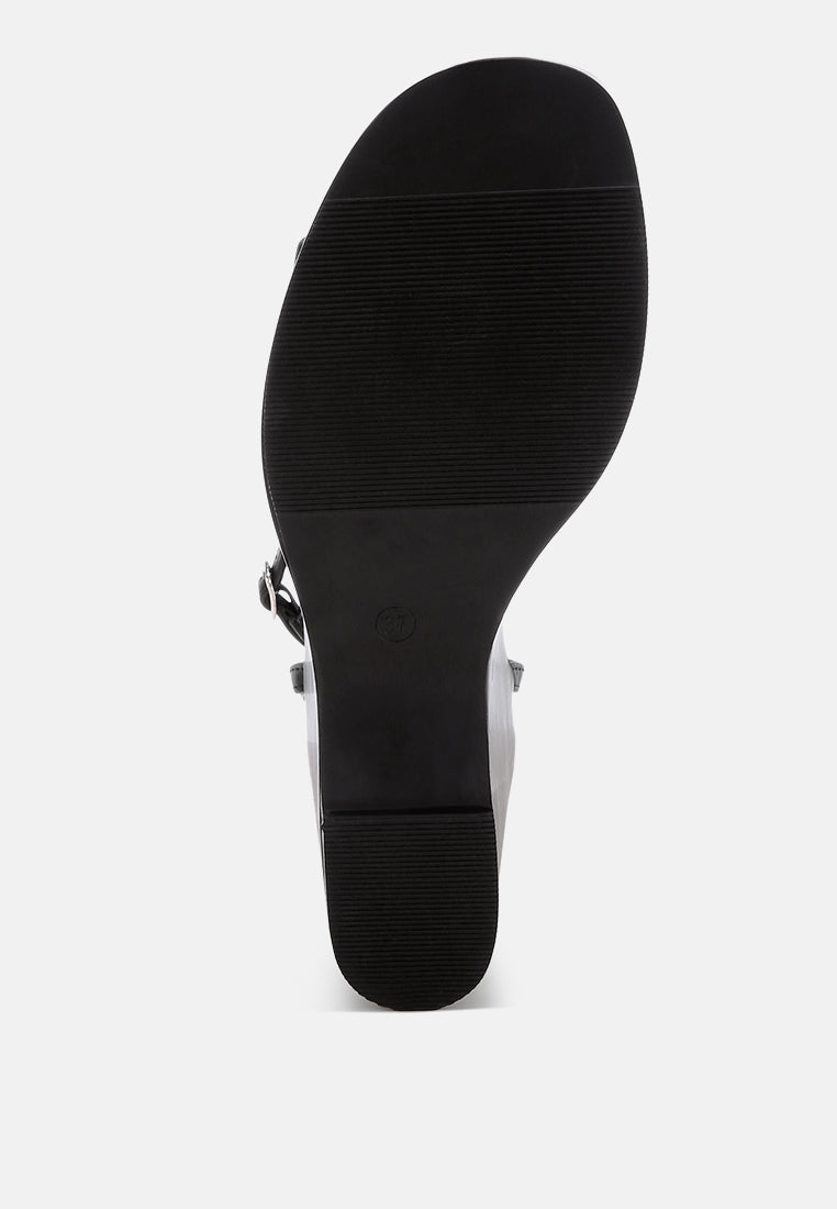 sangria solid platform faux leather wedges by motes#color_black