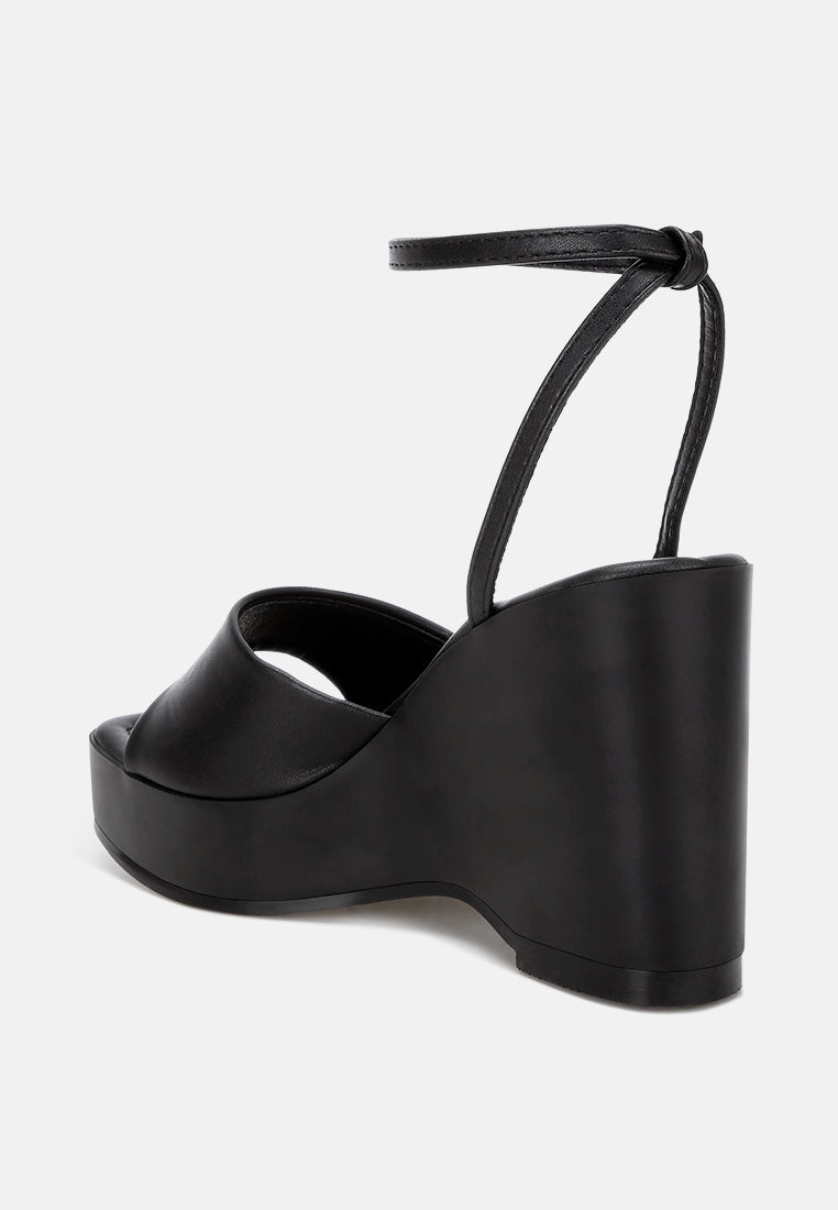 sangria solid platform faux leather wedges by motes#color_black