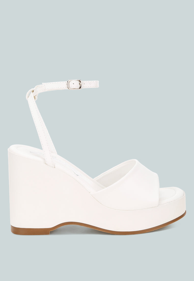 sangria solid platform faux leather wedges by motes#color_white