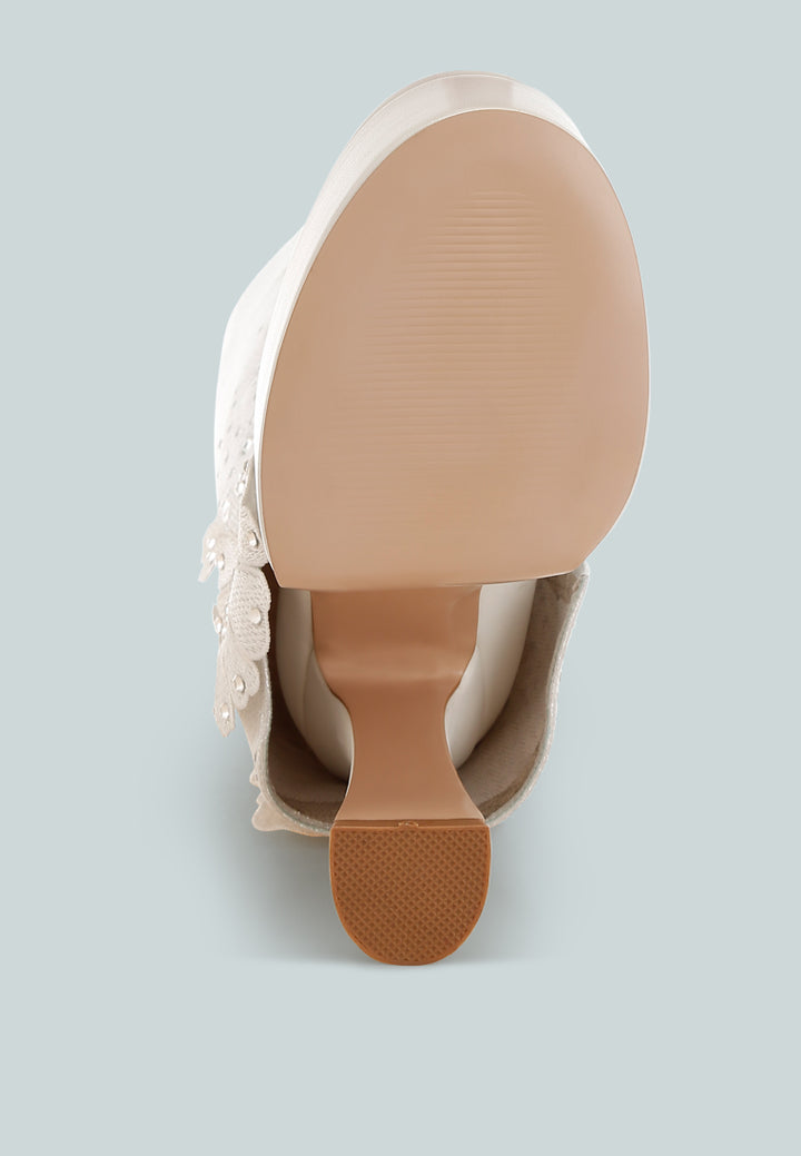 sundra floral applique platform heeled boots#color_white