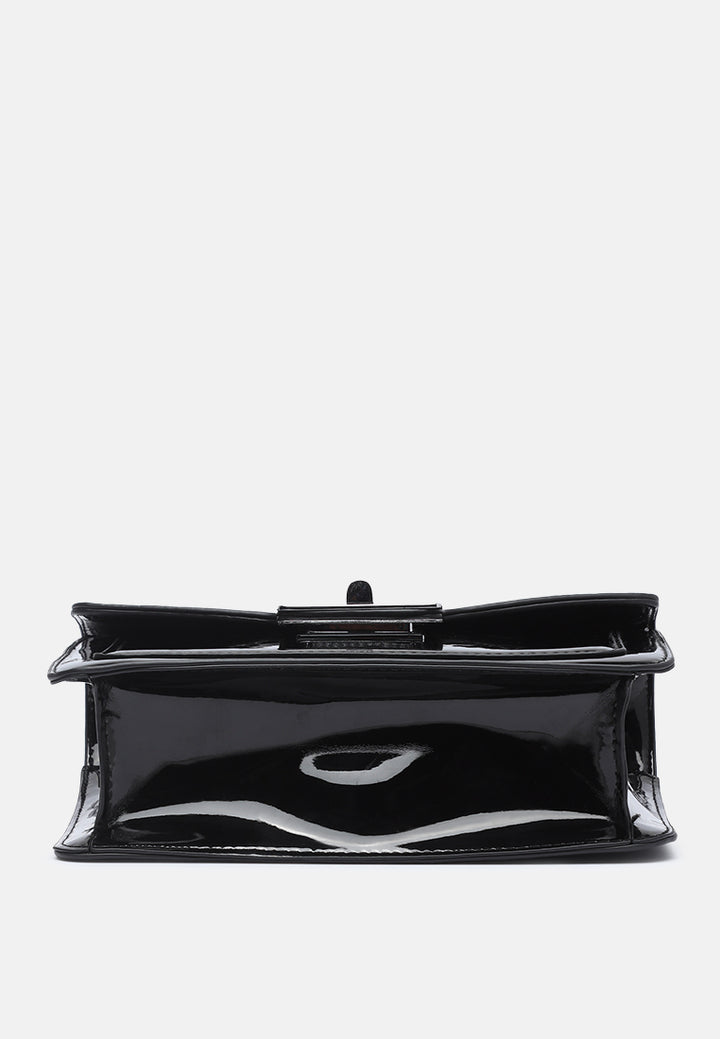 classic sling bag with twist and lock closure#color_black
