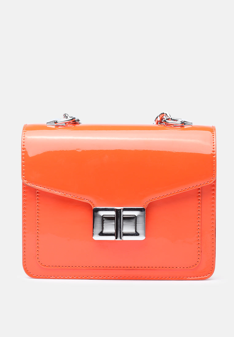 classic sling bag with twist and lock closure#color_orange
