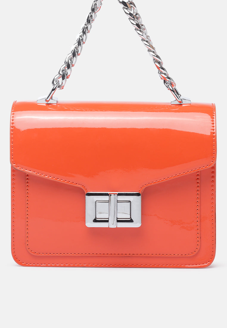 classic sling bag with twist and lock closure#color_orange