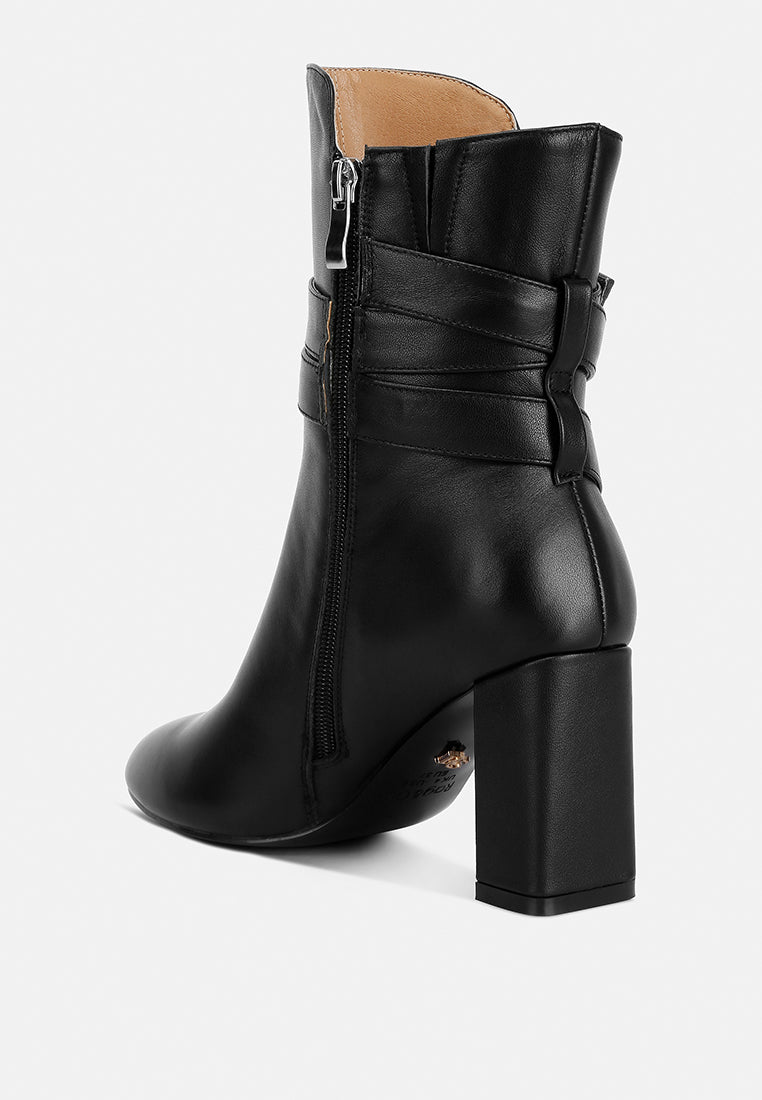 cobra buckle strap embellished boots#color_black