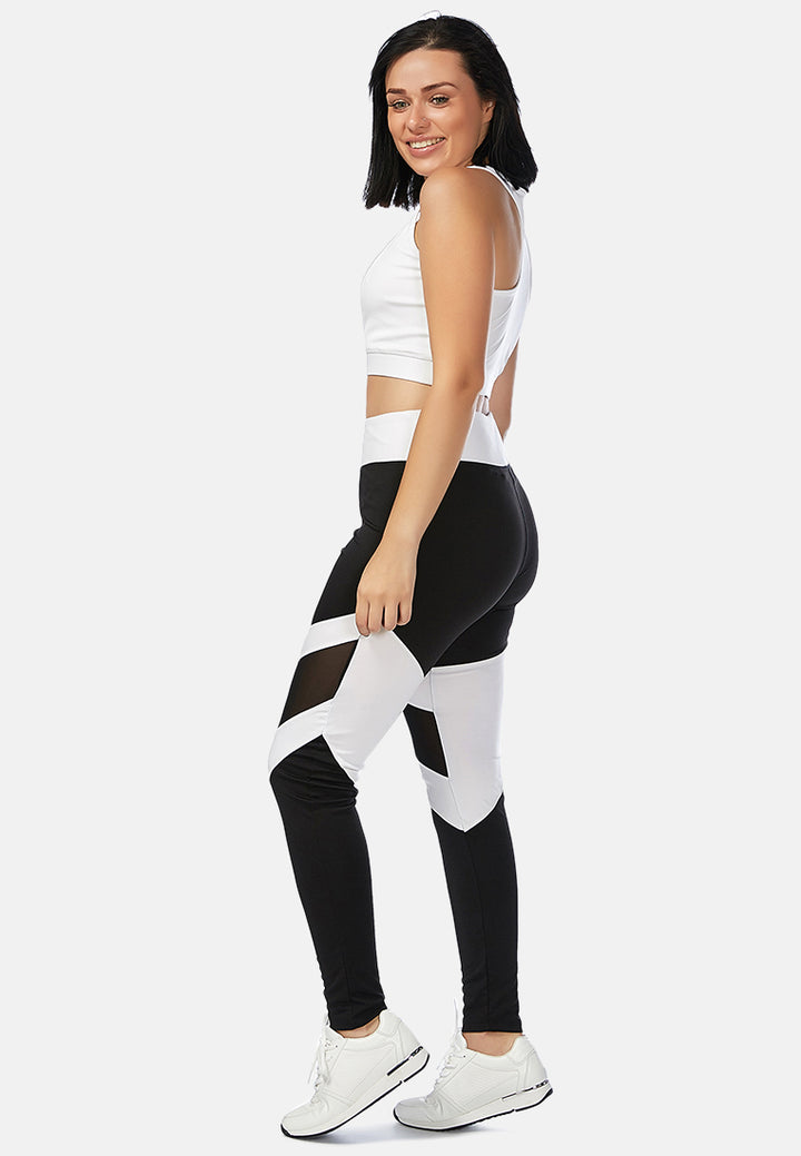 geometric paneled mesh yoga leggings#color_black