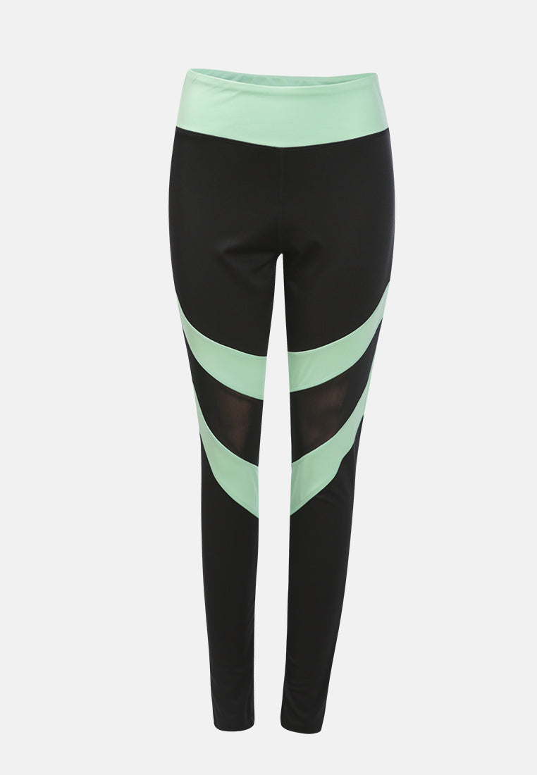 geometric paneled mesh yoga leggings#color_black-sea-salt-green