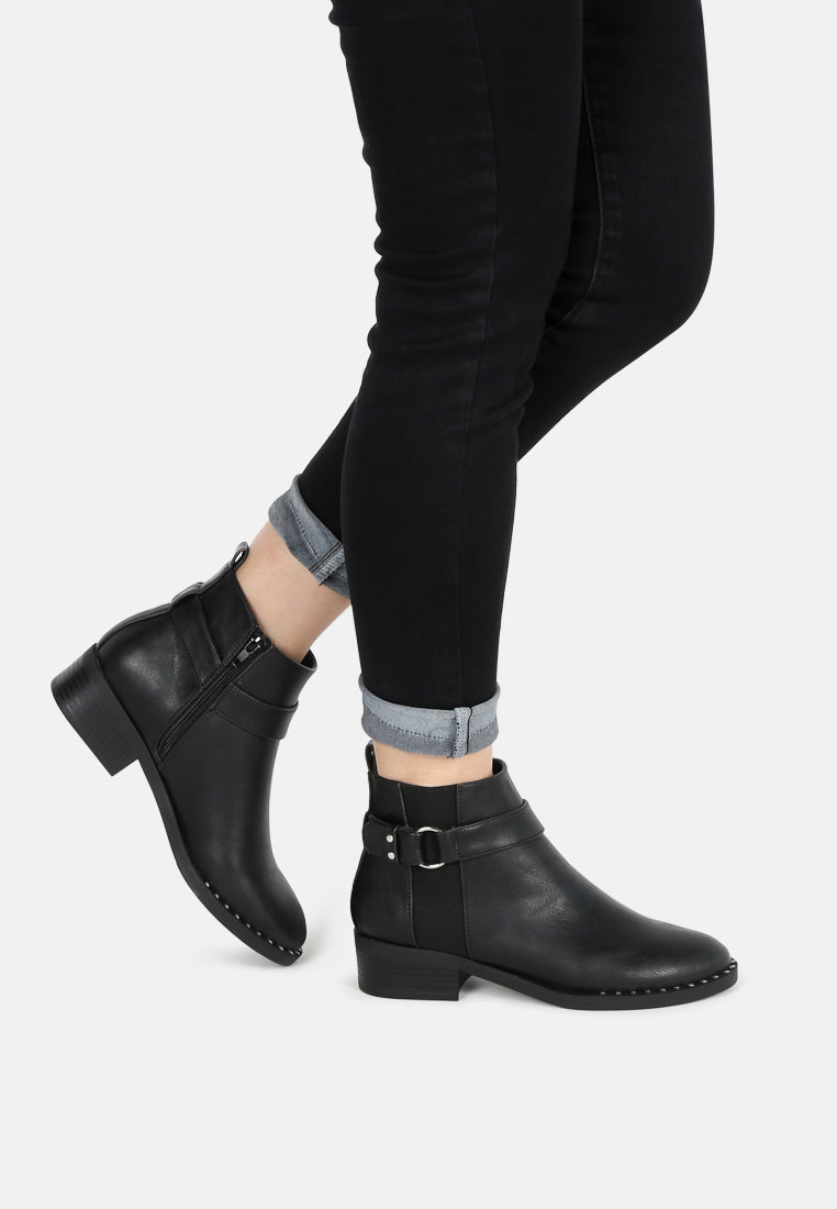 nia ankle length boots with gold rim#color_black