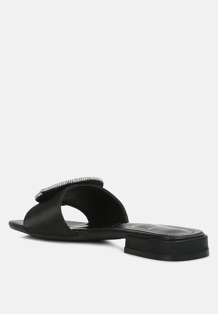 ollilie rhinestones embellished brooch slip on sandals in black#color_black