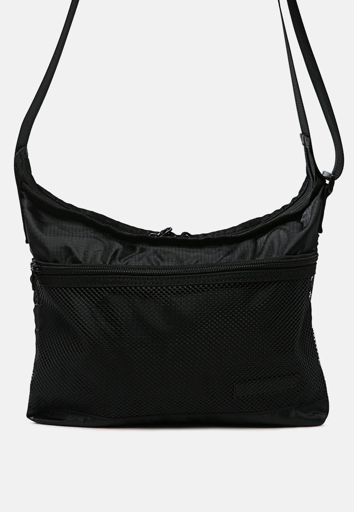 on the move cross body bag#color_black