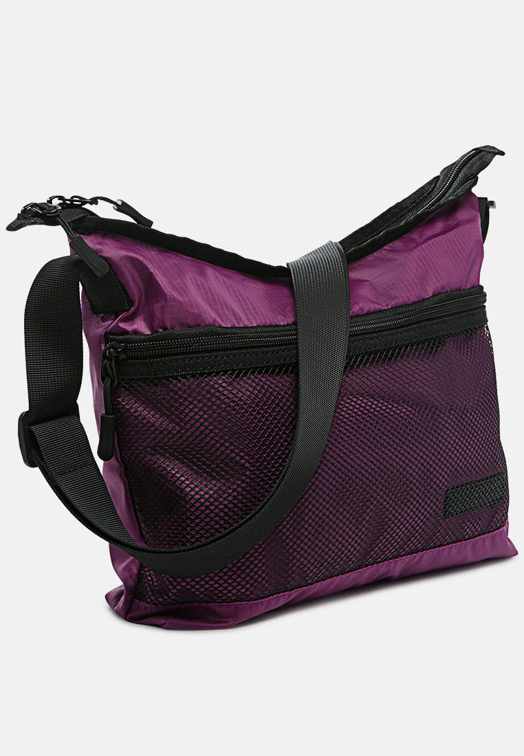 on the move cross body bag#color_purple