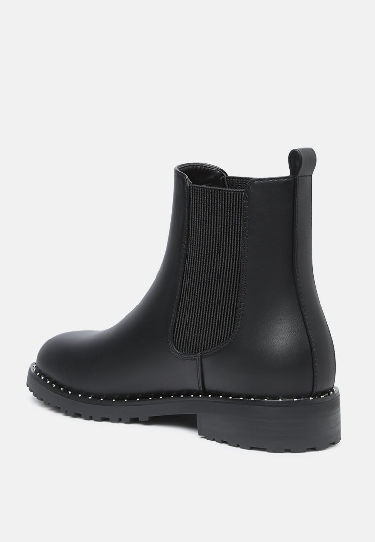 riri studded solid tone chelsea boots#color_black